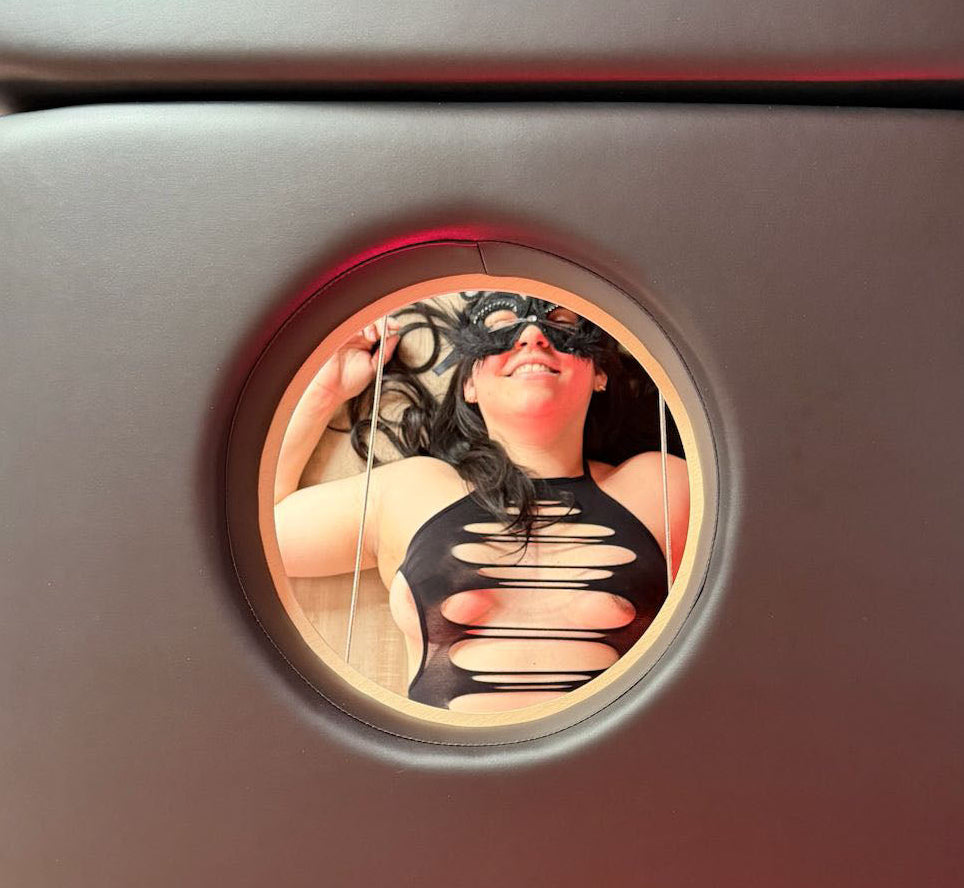 Decorative sticker with a woman in lingerie under a milking table with a hole